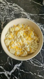 cheese melting into mashed potatoes