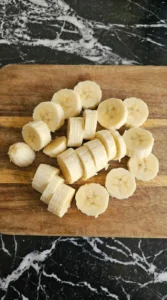 Banana sliced into uneven coins for Cottage Cheese Protein Bowl