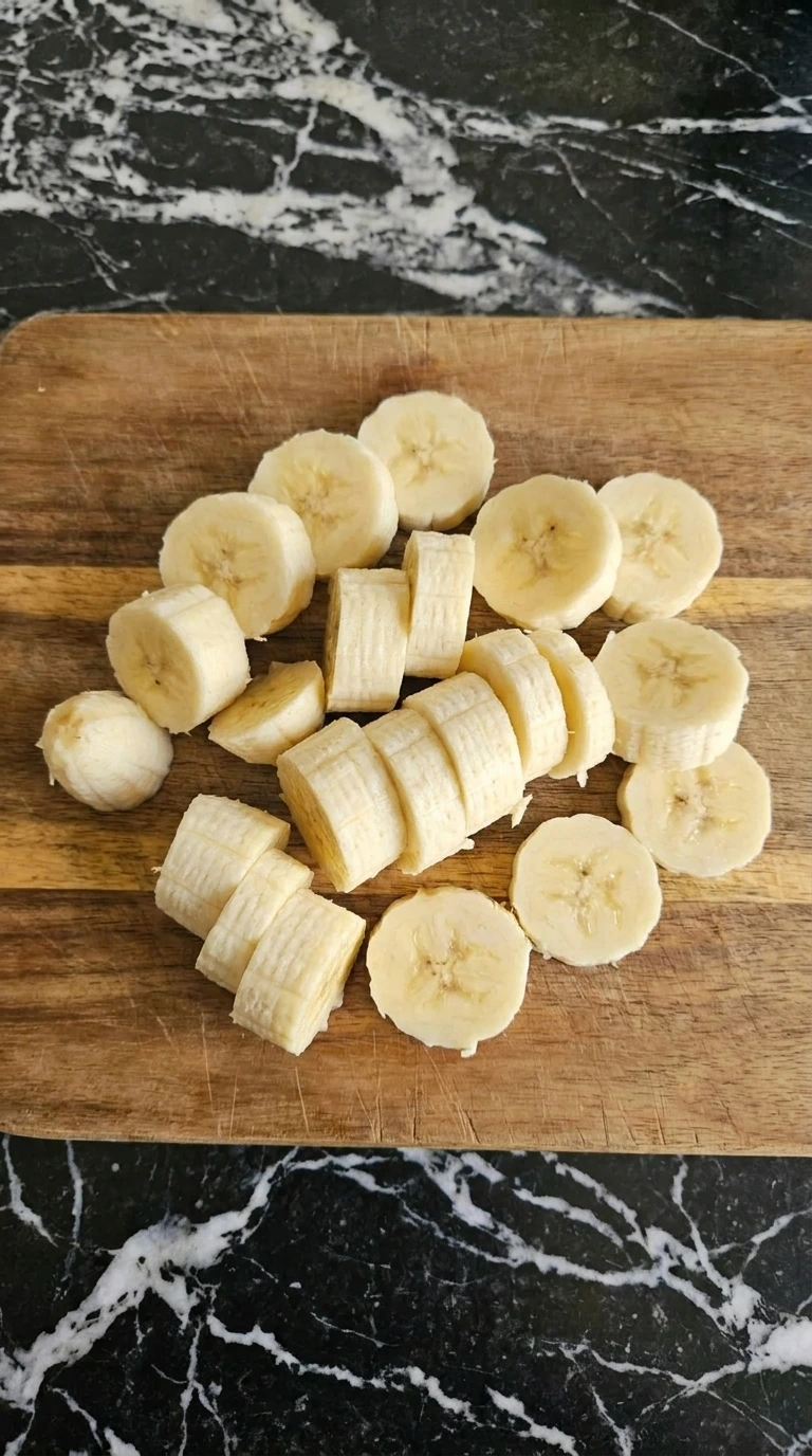Banana sliced into uneven coins for Cottage Cheese Protein Bowl