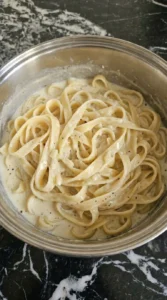 Fettuccine coated in garlic parmesan sauce for Creamy Garlic Parmesan Pasta.