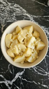 crushed garlic over potatoes