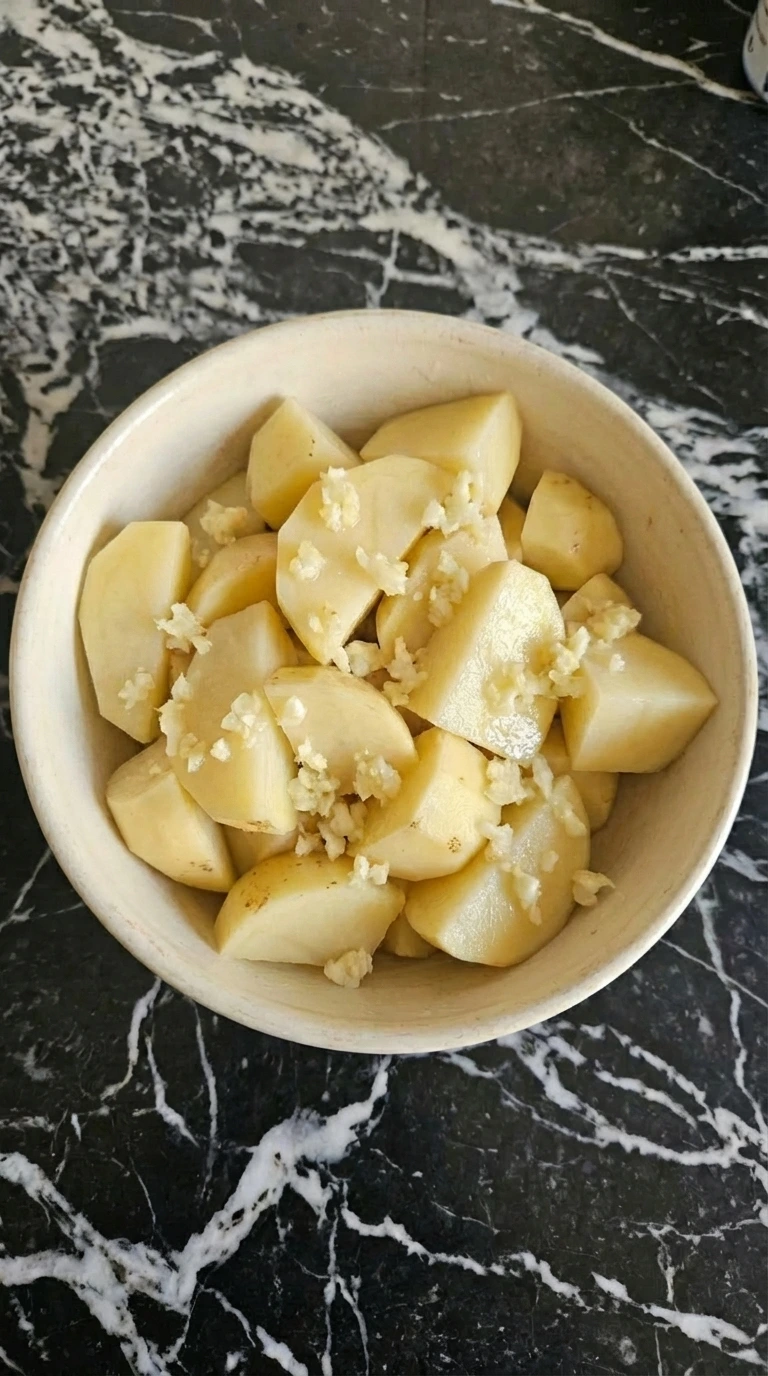 crushed garlic over potatoes