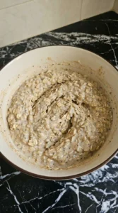 Creamy overnight oats mixture folded until evenly thick.