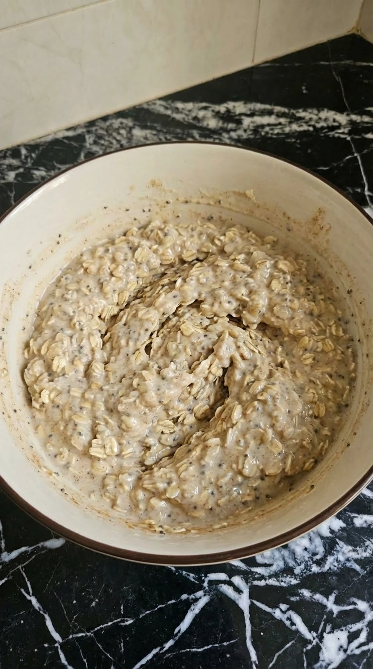 Creamy overnight oats mixture folded until evenly thick.