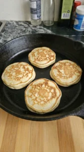 Flipped pancakes finishing with golden brown patches