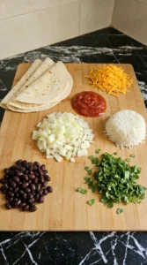 Diced onion and chopped cilantro with burrito fillings gathered for Homemade Burrito.