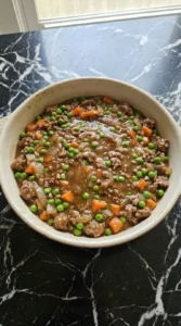 Shepherd’s Pie lamb filling in a ceramic baking dish
