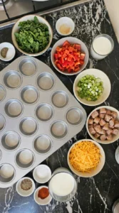 Chopped vegetables and measured ingredients for egg muffins