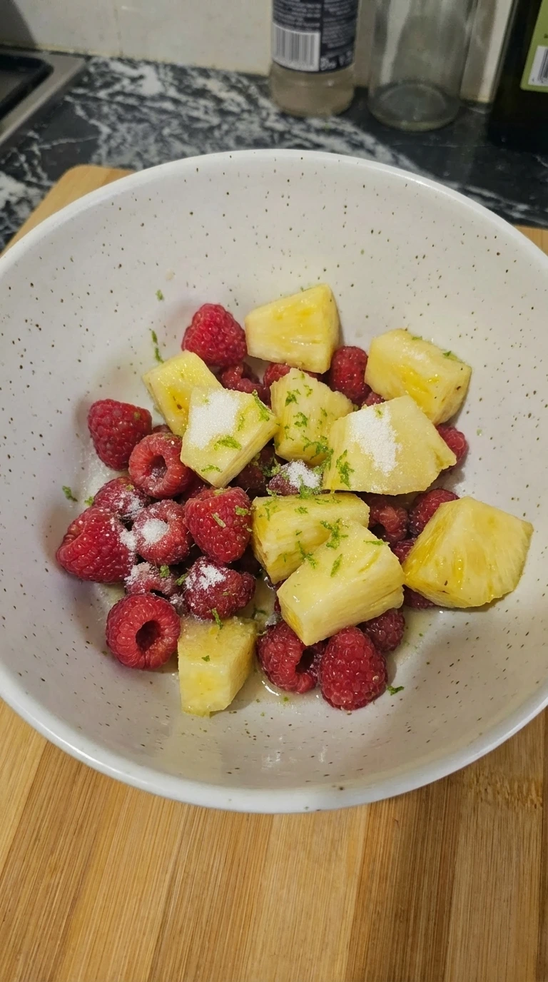 Fruit seasoned with sugar salt and lime juice in a bowl