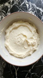 Cream cheese frosting in bowl
