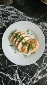 sliced chicken breast showing juicy interior and golden crust