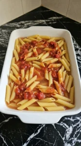 pasta with marinara and water unevenly mixed