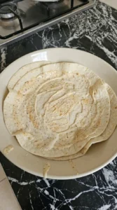 tortillas with sauce spread unevenly