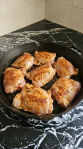 Boneless skinless chicken thighs coated with taco seasoning.