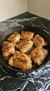 Chicken thighs browned with light char for tacos.