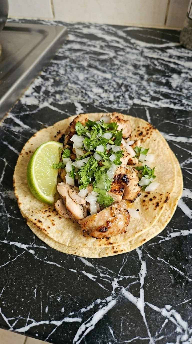 Cooked chicken chopped into bite sized pieces for tacos.