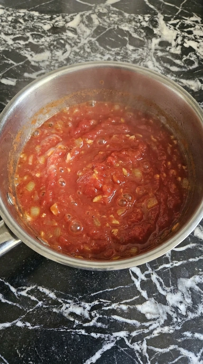 simmering tomato sauce