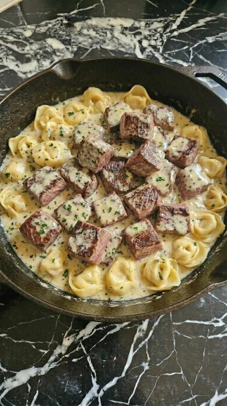 Steak and tortellini in creamy garlic sauce
