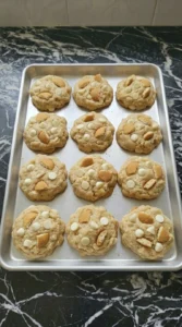Fresh baked banana pudding cookies with golden edges on a tray