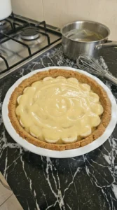 Banana rounds layered with warm vanilla custard inside a baked graham crust.