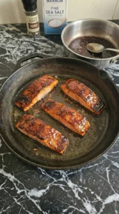 Four fully glazed salmon fillets with a glossy mahogany finish. Recipe focus: Chicken Goat Cheese.