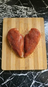 Chicken breasts covered in red spice rub