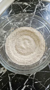 Dry ingredients blended uniformly in a glass mixing bowl