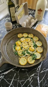 Baby spinach and garlic wilted with browned patty pan squash.
