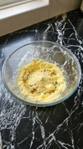 Creaming butter, sugars, and pudding mix in a bowl for Banana Pudding Cookies