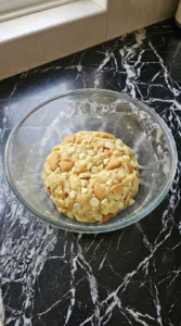 Folding flour and wafer chunks into dough for Banana Pudding Cookies