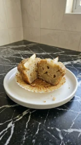 Split Cinnamon Pear Muffin showing moist crumb and Bartlett pear pieces