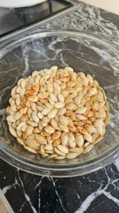 Crispy Air Fryer Pumpkin Seeds (Ready in 15 Minutes) coated with olive oil and paprika