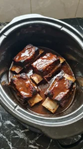 Crockpot Beef Short Ribs coated with glossy mahogany glaze.