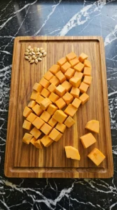 Peeled butternut squash cut into one-inch cubes for hummus