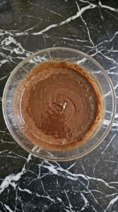 Fudgy Chocolate Zucchini Brownies (No One Will Guess!) step showing a glossy warm chocolate and egg mixture
