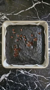 Fudgy Chocolate Zucchini Brownies (No One Will Guess!) fresh from the oven with a thin crackled top and moist center