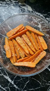 Garlic Parmesan Roasted Carrots coated with garlic butter, herbs and grated Parmigiano-Reggiano