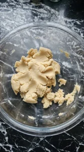 Mixing the soft cookie dough for Halloween Fruit Pizza with Sugar Cookie Crust