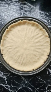 Pressed round crust for Halloween Fruit Pizza with Sugar Cookie Crust before baking