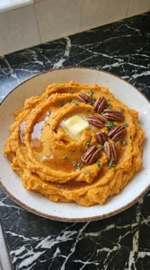 Finished Maple Sweet Potato Mash with toasted pecans, butter and thyme