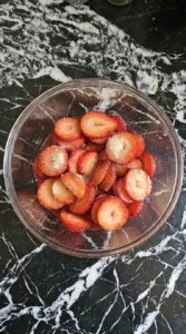 Macerating strawberries for Neapolitan Ice Cream Sundae (Strawberry, Chocolate & Vanilla) until glossy ruby syrup forms.