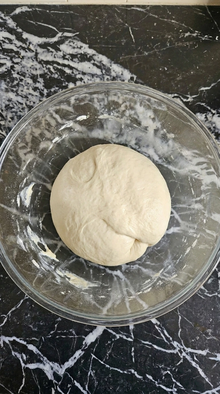 Neapolitan Pizza Dough Recipe (Easy Authentic Napoli-Style Crust) step 2 showing smooth kneaded dough with salt incorporated