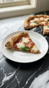 Neapolitan Pizza Dough Recipe (Easy Authentic Napoli-Style Crust) step 7 showing one sliced portion with an airy honeycombed rim