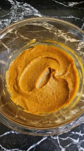 Pumpkin Cream Cheese Danish step showing thick spiced pumpkin filling in an amber bowl