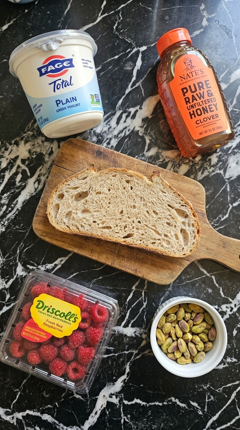 Ingredients for Raspberry Yogurt Toast scattered on a counter