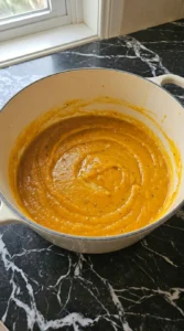 Blended puree for Sheet Pan Roasted Butternut Squash Soup in a Dutch oven