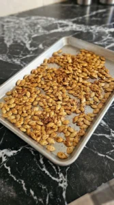 Chili Roasted Pumpkin Seeds roasting until golden amber with crisp blistered shells Recipe focus: how to make savory pumpkin seeds.
