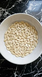 Drying clean raw pumpkin seeds for Cinnamon Sugar Roasted Pumpkin Seeds before seasoning