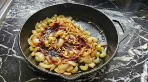 Softened onion, celery and toasted tomato paste for Crockpot Beef Barley Soup Recipe focus: beef barley soup in crockpot.