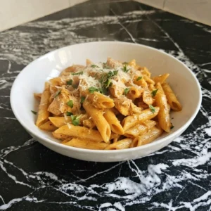 CrockPot Cajun Chicken Pasta creamy chicken pasta with Cajun sauce in serving bowl Recipe focus: cajun chicken pasta crockpot.